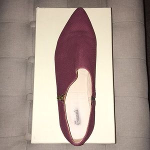 Burgundy croc, gold zip flat.